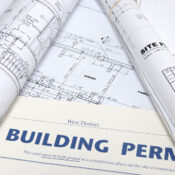 Blueprints and a building permit for electrical work in Renton, WA