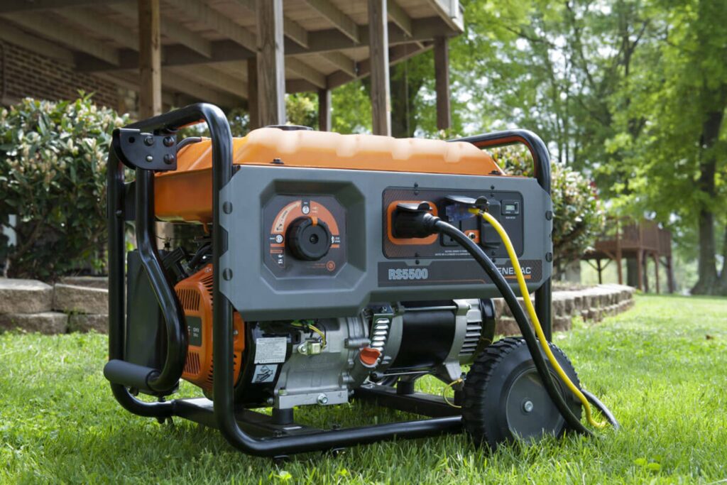 Portable generator running outdoors providing backup power for a home during an outage